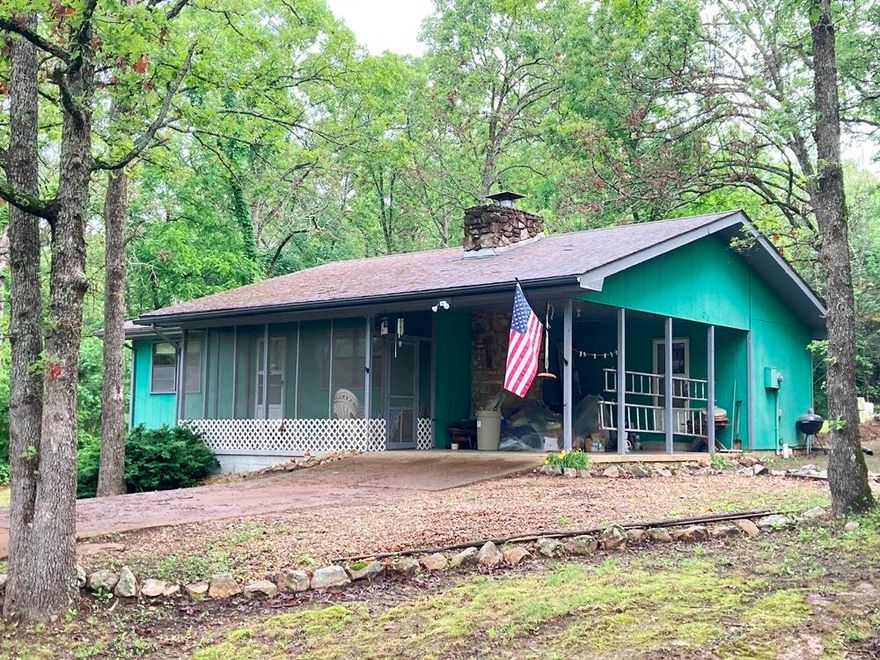 SEASONAL LAKE VIEWS OF DIAMOND LAKE!  2 Bedroom, 1 1/2 bath home on TWO LOTS just across the street from the boat launch on Diamond Lake in Horseshoe Bend AR. This home would make a great first-time buyer’s home or a great vacation home. New carpeting through-out and both bathrooms have been recently updated. Screened-in front porch to enjoy the cool breezes coming off the lake and a nice native stone wood burning FIREPLACE to warm the spacious living room of the cool winter evenings. All appliances come with the home including the washer & dryer. The septic system has just been updated in June 2024 with a new pump tank and new field lines installed.  Listed for $125,000 so Don’t hesitate or this deal will be gone! Listing #2380 Measurements per ARCountydata.