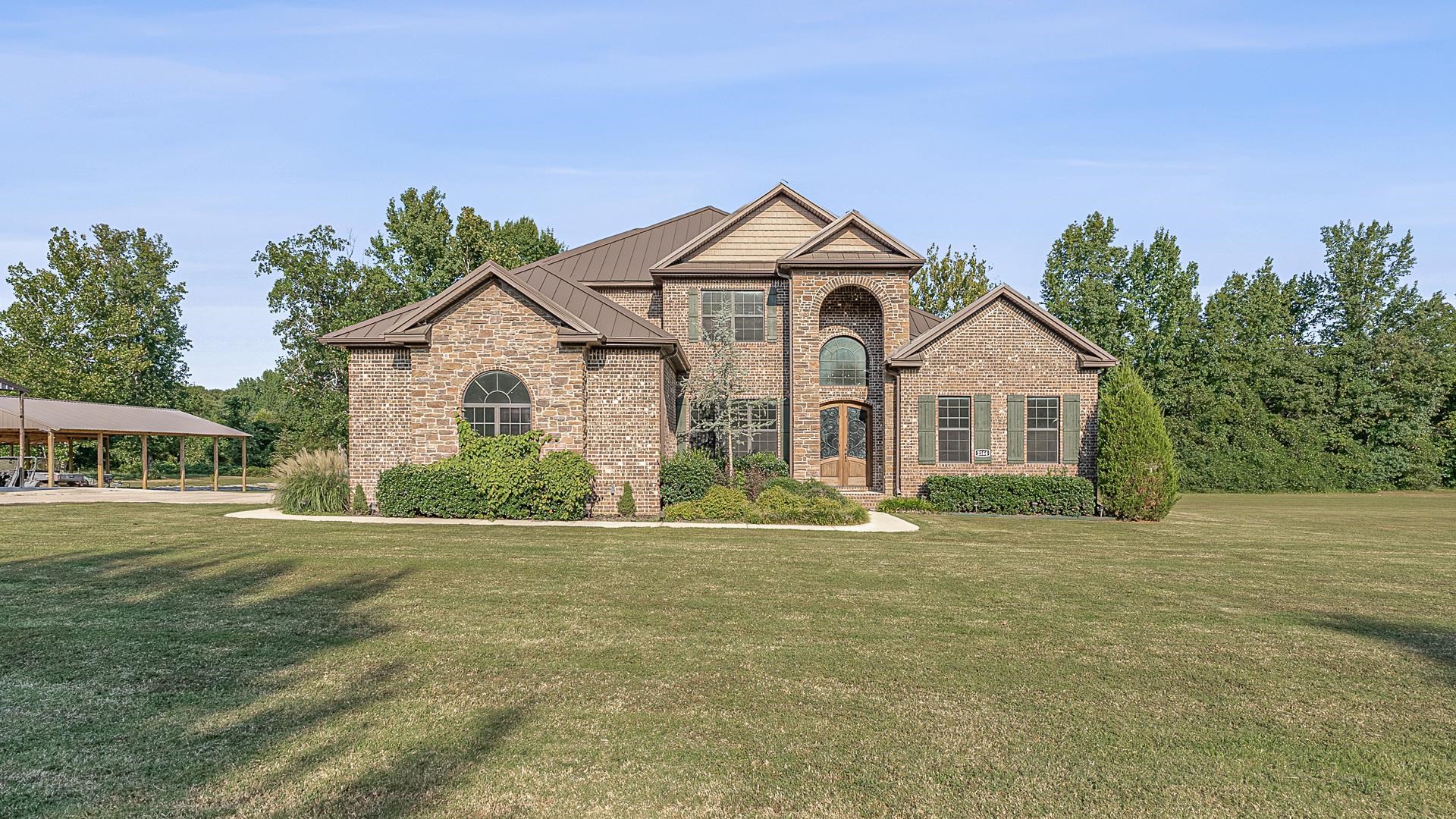 Welcome to your dream home! This stunning 5-bedroom, 4-bathroom residence sits on a sprawling 2.5-acre lot. As you approach the property, you'll be greeted by a charming exterior and an inviting atmosphere. Step inside to discover a well-designed layout that blends comfort and luxury. The spacious living area features a cozy fireplace, perfect for gathering with family and friends. The design flows seamlessly into the gourmet kitchen, equipped with a large Kenmore elite fridge, dual convection oven, and tons of storage space! The main floor includes a luxurious master suite with an elegant bathroom which includes a walk-in shower, jacuzzi, and a walk-in closet. Additionally, there is another bedroom, full bathroom, bonus room, dining area, and built in kennel for your furry friends all on the main floor! Upstairs includes 3 bedrooms, 2 full bathrooms, and lots of unfished attic space for an ideal storage location. And there's more! This home comes with additional features such as an above-ground saltwater pool with a fenced deck connected to the porch, an outdoor area for animals, a 30x50 pole barn, a 20x60 man cave, and a 24x50 shop!