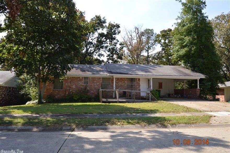 large brick home with two carport attached. Excellent location. Wondeful fixer up. Great first time home. Property is being sold "AS IS"  and is subject to HUD Guidelines 24 CFR 206.125.