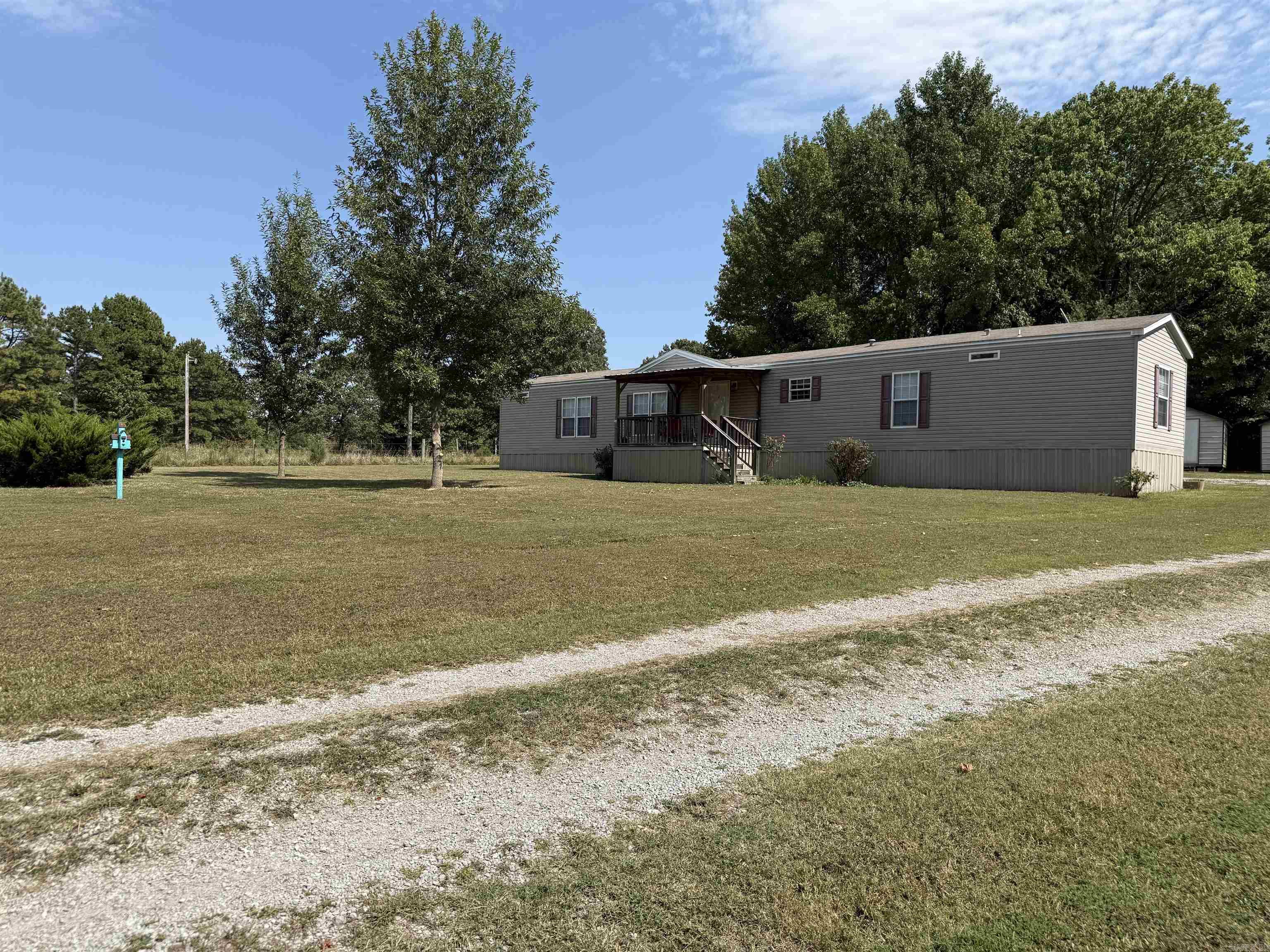 Looking for a move-in ready home without breaking the bank? This well-maintained manufactured home offering 1,312 sq ft of single-story living located at 701 WPA Rd, Sulphur Rock is it! Home offers 3 bedrooms, 2 bath. Master bathroom features a large bathtub, separate walk-in shower & double vanity. With a double carport, a private deck for enjoying the outdoors, and the practical layout, itās just right for those wanting comfort and value. 2 storage buildings also stay on the property, perfect for all those extra storage needs! Property is also equipped with a large storm cellar.