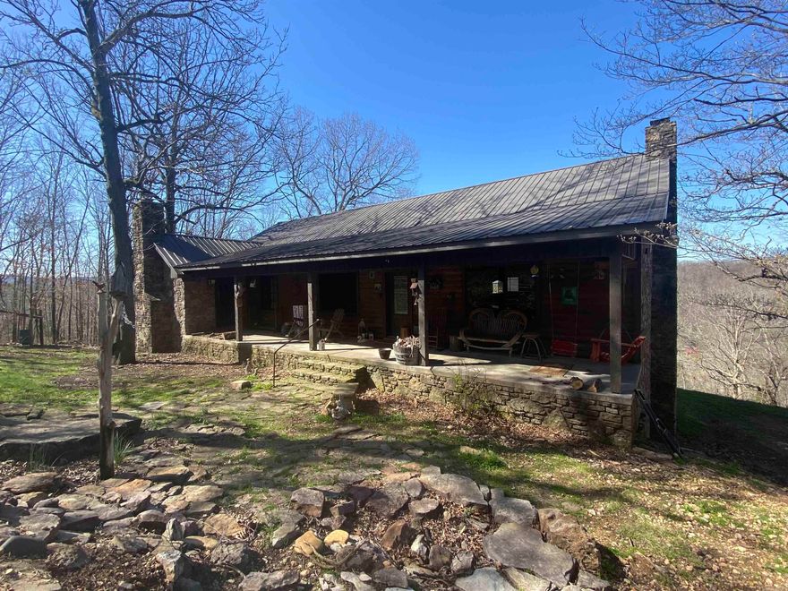 Welcome to this charming 4-bedroom, 3-bathroom house nestled in the serene landscape of the Ozark Mountains with a beautiful view of the Sylamore Creek Valley. As you approach, you're greeted by the sight of a picturesque exterior with a blend of rustic and modern architecture with native stone covering most of the home. As you walk in you will notice the spacious living room and cozy rock fireplace with a separate dining room and a world class kitchen with oak cabinets, granite countertops and a commercial stove with double ovens, warming rack and flat top griddle! This is a one of a kind kitchen that will make your gatherings stand out from the rest! Down the hall is the master bedroom and bath with a custom clawfoot tub and fireplace for when you want to relax in private. There is also another bedroom and bathroom on this same level. The basement is built for entertaining. There is an additional 2 bedrooms and bathroom in the basement and the basement bath is just as nice as the rest of the home with a claw foot tub and walk-in shower! Also, lets not forget the unfinished guest house that is waiting for your finishing touches. There is more to see so call today for a showing!!