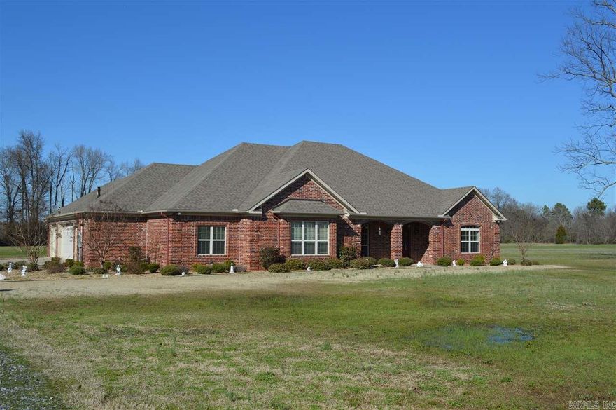 Impeccable One level home on 4.68 acres.   Open floor plan w/ hardwood floors in the living room with a two sided fireplace & french doors that lead to the Sunroom w/ tongue & grove walls and ceiling.   Slab granite tops off the stained cabinets w/ an enormous island plus 2 pantries and a breakfast area.  Large mudroom and Laundry off the kitchen/garage with a full bath.  3 tankless water heaters.  Zoned HVAC. 2x6 exterior walls with foam insulation & insulted interior walls.  3 Car Garage.