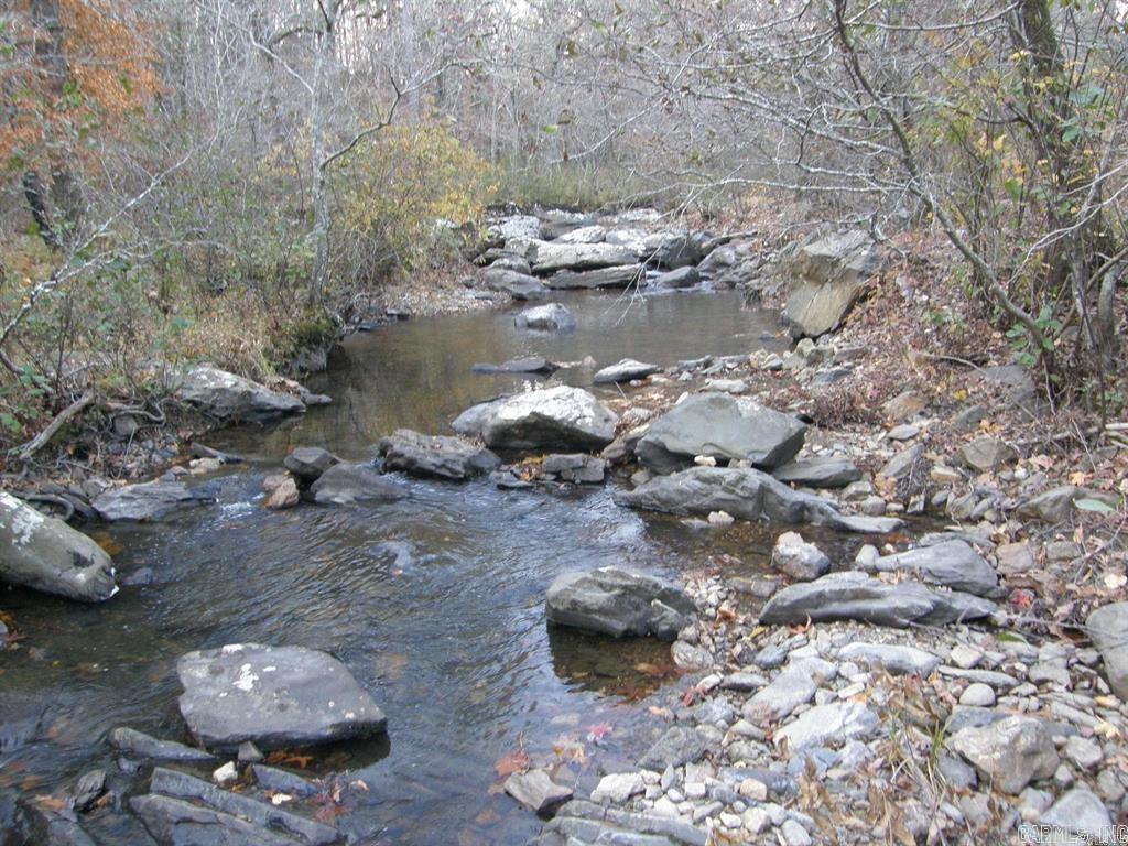 SHADY ACREAGE! iN THE MOST DESIRABLE AND PICTURESQUE LOCATION WITH MUCH WATER. In the midst of the Beautiful Ouachita Mountains and the Ouachita National Forest. Joins the National Forest on 2 sides. Joins the Cossatott River. Crossed through by Mine Creek. Ready access to ATV trails. Contains a campgound with pavilion. It has electricity, a well, and is believed to have a septic system. This property would also make a desirable homesite or cabin rental service or RV rental grounds. The Shady area contains much beauty, much wildlife including deer, turkey, squirrels, rabbits and a few bears. There is a church, a community building, and Thibodeau's Country Store. Rare property in the Shady Mountains and joining the Cossatott River. Offered as a surveyed 24.66 acres. For more information, call the listing agent at 479-234-3530.