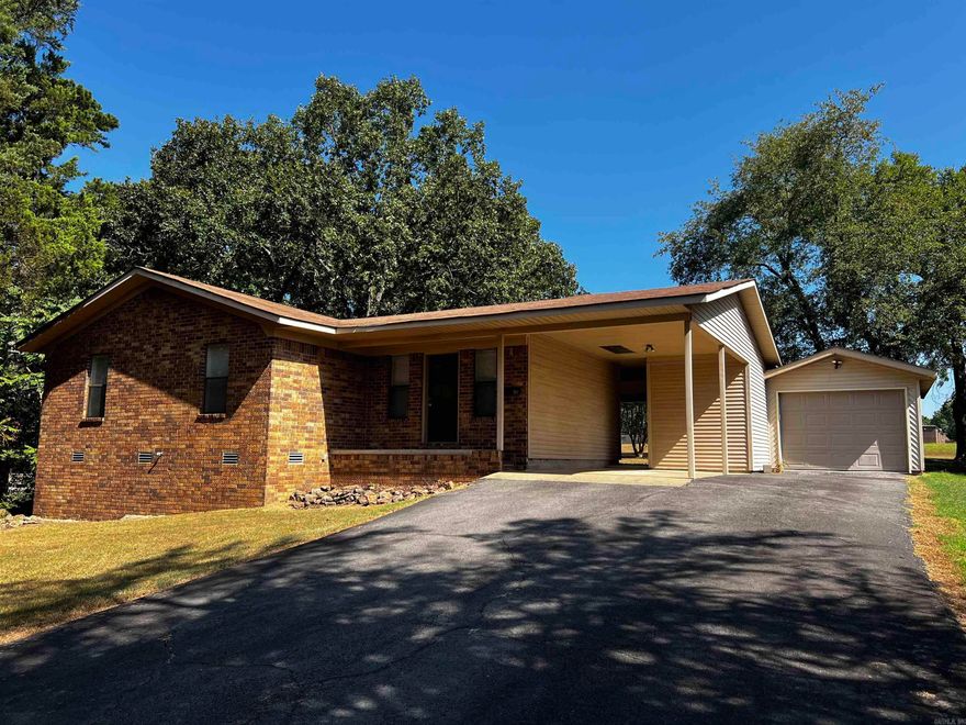 Updated and move-in ready 3 bedroom home on approx .67 acres, large covered private back porch with mature trees providing shade, back yard joins open field with room for kids and dogs to run, low maintaince brick and siding home, with carport and a single car garage, with outside storage, the primary bedroom is large enough for a king bed and  has his and hers closets, open kitchen with a separate dining area and breakfast bar, home is near Heber Springs High School, updated in 2023 with new luxury vinyl, central HVAC, and hot water heater