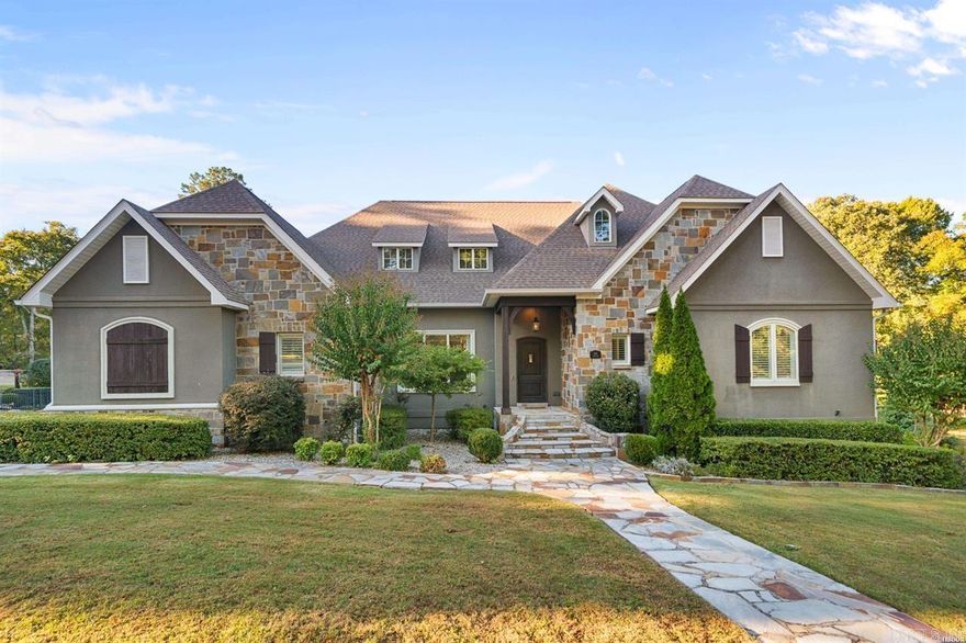 Welcome to this exceptional custom-built home located in the highly coveted Lotus Valley subdivision. This stunning residence offers the perfect blend of elegance, comfort, and craftsmanship, with thoughtful details and luxurious finishes throughout. Boasting over 5,600square feet of living space, this home features five spacious bedrooms, four full baths, and two half baths, providing ample room for family and guests. Situated on two beautifully landscaped lots, the property offers a sense of privacy and tranquility rarely found. Multiple covered patios create ideal spaces for outdoor living and entertaining, while the expansive green space surrounding the home provides plenty of room for recreation, gardening, or simply enjoying the natural setting. Whether hosting large gatherings or quiet evenings outdoors, this property is designed for every occasion. Step inside to an inviting open-concept floor plan highlighted by soaring vaulted ceilings, abundant natural light, and rich hardwood floors that flow throughout the main living areas.