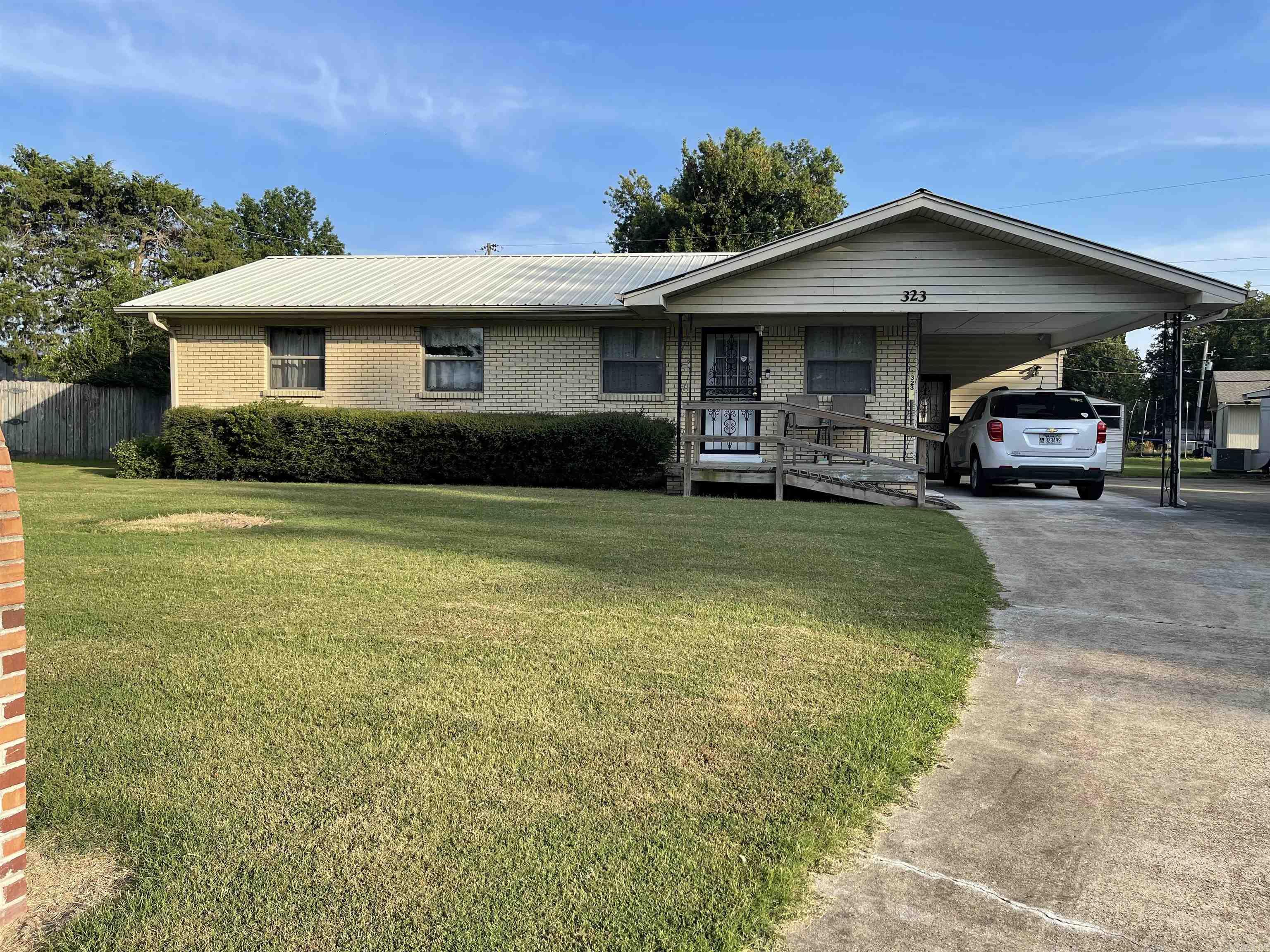 New to the market is this beautiful brick home sitting in a corner. This home features 3 bedrooms, 2 Bath, carport, storage building, workshop with a/c, screened porch and metal roof. Donāt wait too late!