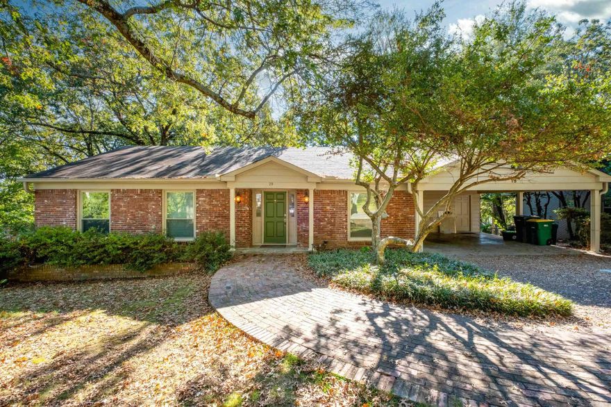Classic mid-century brick home in great neighborhood with easy access to Heights, Hillcrest, banking, shopping, hospitals & much more! Nestled on large lot with chef's eat-in kitchen, Viking gas range, custom cabinets, quartz counters. Main level has living room with fireplace, dining room, kitchen, 3 bedrooms, 2 full baths, laundry, 2-car carport.  Lower level (opens to backyard patio) has new carpet, den with fireplace, office/workshop, huge walk-in closet, 1/2 bath.  Exterior access to under house storage & carport storage closet. AGENTS, BEFORE SHOWING, pls see agent remarks.