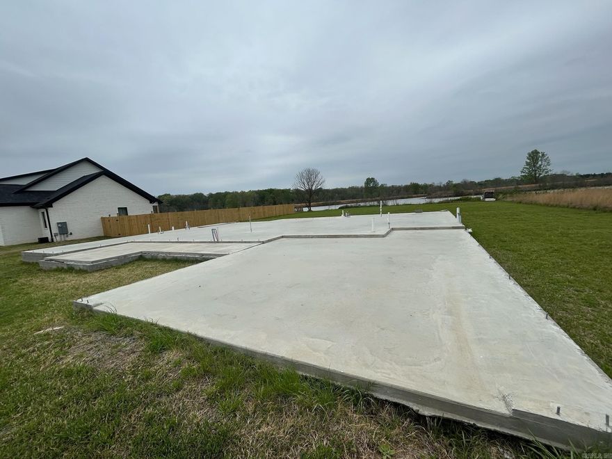 1/2 acre waterfront lot in a gated community. Comes with house plans for a 3 bed 2 bath home. start building asap. just need a lumber order. tremendous savings!