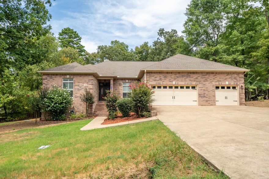 Embrace resort-style living in the heart of the coveted Diamondhead Community—where golf course greens and serene lake views set the stage for your dream home. With nearby access to championship golf and the beautiful lake (private boat slip available for purchase), this all-brick home blends elegant living with outdoor adventure. Inside, enjoy 3 or 4 bedrooms, 2.5 baths, an open layout, hardwood floors, crown molding, a brick fireplace with wood stove insert, and a gourmet kitchen with stainless appliances, double ovens, ice maker, island, and walk-in pantry. The primary suite features dual closets, spa bath, and screened porch access. Outside: new deck, screened porch, basketball court, and oversized gate. Updates include new roof (April 2025), HVAC, gutters, and septic. 3-car garage with storage. Peaceful upscale community with golf, lake, and amenities just moments away. Schedule your private tour today
