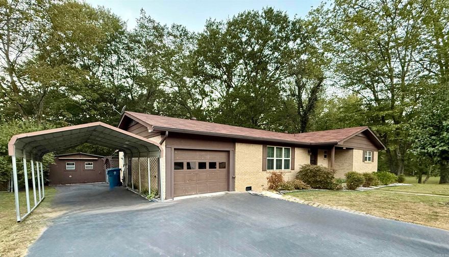 Come see this 3 bed 2 bath brick home in Malvern School District! It sits on multiple lots providing expansive outdoor living on approximately 2 acres! The indoor space is also roomy with a large kitchen and spacious bedrooms. There is an oversized bonus room being used as additional dining space that could easily be converted to a 4th bedroom or family room! You will appreciate all the extra parking space with a 1 car garage and a carport!