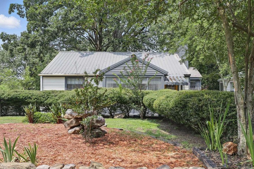 This delightful 2 bedroom, 1 bath home offers a perfect blend of classic character and modern updates. Enjoy the original wood floors, an updated bathroom, and the kitchen features stainless steel appliances—including a gas stove—and newer appliances that convey, including the refrigerator, washer, and dryer. Step outside to a spacious, fully fenced backyard with a deck and built-in seating—perfect for entertaining. A bonus workshop with air conditioning provides extra space for hobbies or storage. Durable metal roof for added peace of mind. Conveniently located near UALR, shopping, and more!