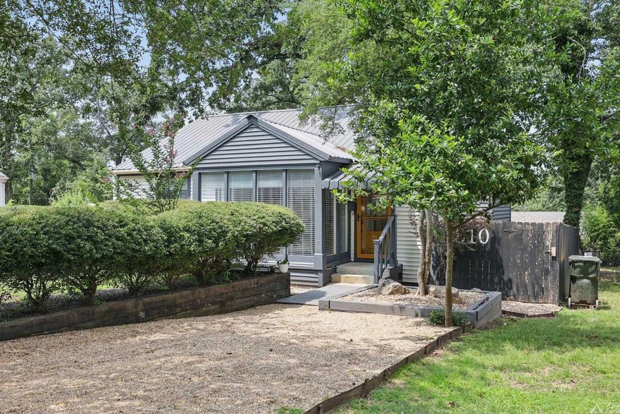 This delightful 2 bedroom, 1 bath home offers a perfect blend of classic character and modern updates. Enjoy the original wood floors, an updated bathroom, and the kitchen features stainless steel appliances—including a gas stove—and newer appliances that convey, including the refrigerator, washer, and dryer. Step outside to a spacious, fully fenced backyard with a deck and built-in seating—perfect for entertaining. A bonus workshop with air conditioning provides extra space for hobbies or storage. Durable metal roof for added peace of mind. Conveniently located near UALR, shopping, and more!