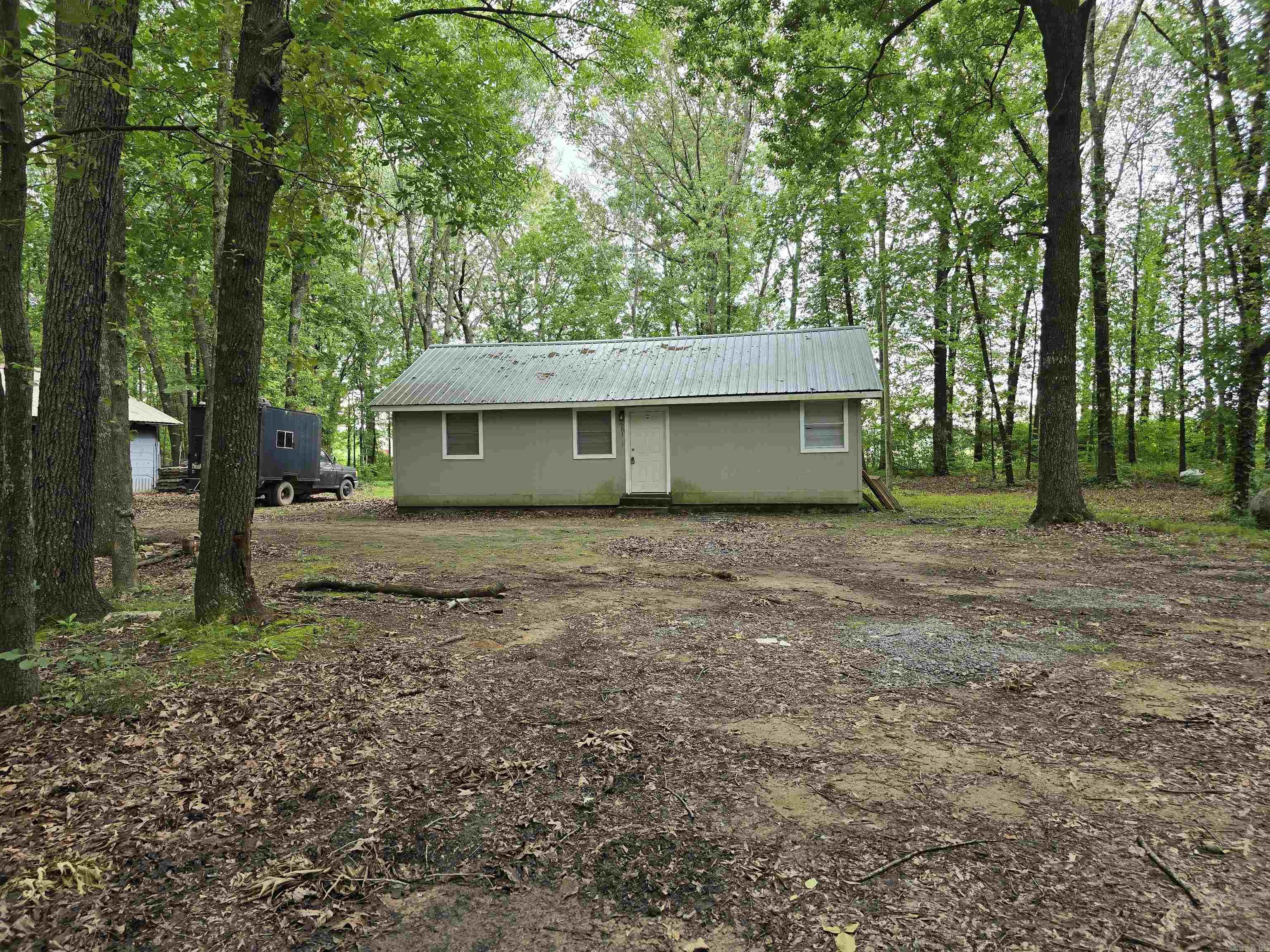 Quaint 2 bed, 1 bath home on 2.15 acres. Lots of trees for the added privacy. Comes with washer, dryer and refrigerator.