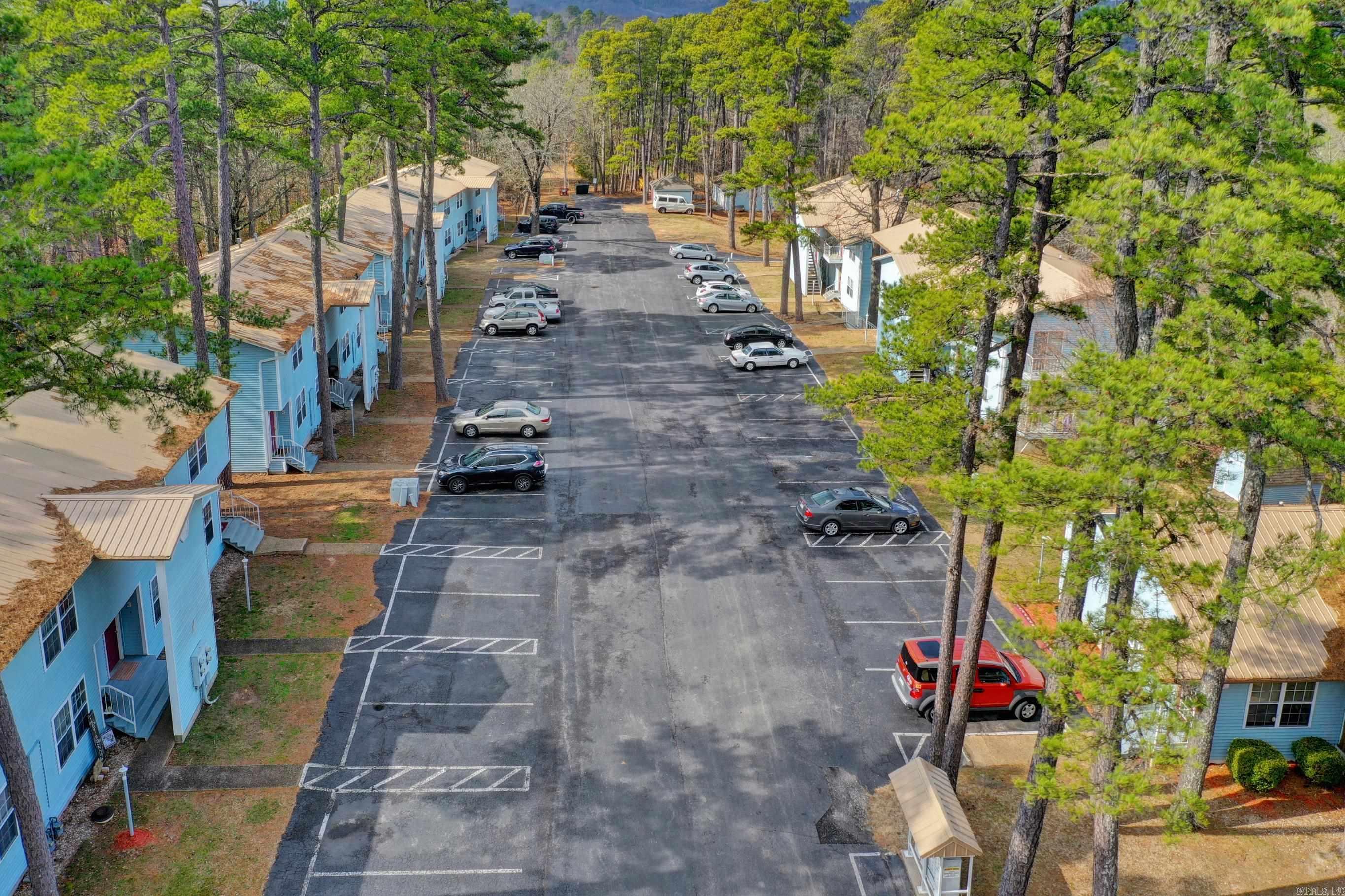 Well, established 27-unit multifamily opportunity in NWA. Property management office and living quarters onsite. Managment is in place. Recently renovated in 2020 with many upgrades. 100% occupied with stable income. Walk out basement area could be finished out for additional apartments. Maintenance workshop area and storage onsite. Located close to the downtown area and near main vein of Eureka Springs.