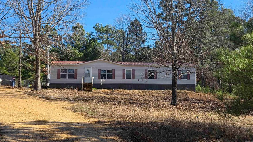This well-maintained 2017 manufactured home, set on pillars and footings and placed in the spring of 2018, offers 2,040 sq ft of comfortable living space per appraisal. Located on a quiet dead-end road, the property provides a sense of privacy while still offering convenient access to Jonesboro, Brookland or Paragould! The home features 5 bedrooms & 3 bathrooms, arranged in a desirable split-bedroom layout. The kitchen is designed for both function and style, complete with a kitchen island, custom shelving, and a pantry for added storage. A dedicated laundry room enhances everyday convenience. Recent updates include a 2023 water heater, a 2025 oven element, and a septic system pumped in 2025. The home is all-electric and includes upgraded insulation for improved efficiency. A durable metal roof adds long-term peace of mind. Outdoor features include a deck for relaxing or entertaining and a fenced-in backyard offering versatile use of the space. The property spans 1.56± acres, providing room to enjoy the outdoors along with two storage buildings. This property blends space, updates, and functionality — a great opportunity for anyone seeking a move-in-ready home with room to grow.
