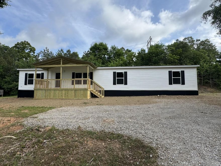 **** Double lot**   The empty corner lot has been added to this property. Now lot size is .76 acre. Brand new 4 bed 2 bath home with an office/bonus room. New manufactured home. on permanent foundation, covered front deck, back deck.  MOVE IN READY. Just minutes from Lake and boat access.  Several new homes being built on this street from seller. All new homes. Entergy smart homes with new features. close to town and all shopping, restaurant's and activities Hot Springs as to offer.  Home Warranty from the builder is included. Seller has several Lenders ready to assist you with a home loan if needed.  Make own measurements.