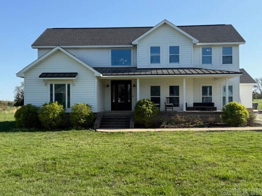 FIRST IMPRESSIONS ARE IMPORTANT! Entertain with pride in this CUSTOM BUILT 5-bedroom, 4-bathroom home BEAUTIFULLY situated on 3.14 acres. Gracious foyer to the OPEN concept living, dining and kitchen. SPACIOUS family room is designed for the homeowner how loves to ENTERTAIN featuring a gas fireplace and TONS of natural light with a window lined wall that provides a view of your POND. There's no telling what you will COOK UP in this dream kitchen! Endless storage space, Bosch double ovens, an island with seating and GORGEOUS finishes. Main bedroom and bath, on the main floor, is situated for privacy, with (2) walk-in closets, a HUGE walk-in shower, claw footed tub and double vanities. Additional guest bedroom and full bath on the main floor along with an office.  UPSTAIRS "hideaway" is great as an additional living area, hobby space or workout area. 2 additional bedrooms each with their own bathroom make this the PERFECT floorplan! PARTY ALL SUMMER on your covered back patio OR take in the scenery on your covered front porch. Within minutes from town, COUNTRY LIVING with CITY CONVENIENCE! Call today for more information!