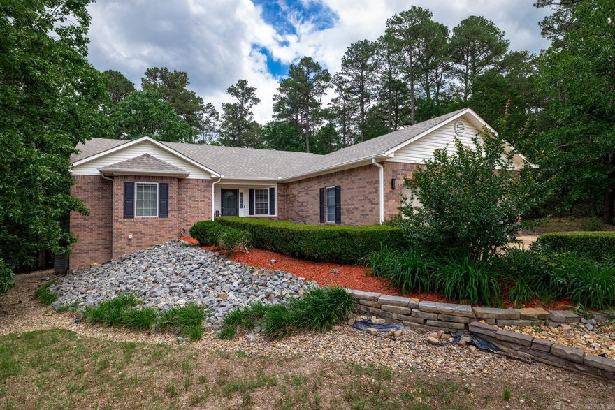 Upon entering the front door, you will find yourself in a large great room with a gas fireplace which has newer logs and a remote control.  The eat-in kitchen has granite countertops and a bar overlooking the dining area and the great room.  The oversized master suite includes a newly tiled shower and walk-in closet.  On the other side of the home are the two guest rooms which share a completely updated bathroom.  The sunroom has a dry bar and two walls of windows overlooking the highly private backyard.  The oversized deck and stairs were added in the last 4 years. All windows in the home have window treatments which include vertical blinds and some draperies.  The garage has an oversized storage area, and there is also more storage under the home. This is a well-maintained home in very good condition.  Do not miss this one!  It will go fast.