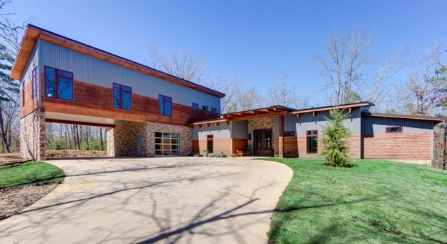 Escape to your very own retreat! Breathtaking views, natural elements, high end finishes and a workshop with apartment make this property a must see. Poured concrete walls, safe room (Noah rated), geothermal heating & cooling, lifetime warranty on roof, accordion sliding walls, custom iron front doors, commercial gas grill, outdoor entertaining, Dacor dbl ovens, 6 burner gas stove, stainless steel appliances and outdoor railing is stainless steel & maintenance free. This home has it ALL!