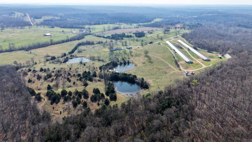 If you’re looking for an income-producing chicken farm in Arkansas, this 96± acre farm is a rare find. Located on a paved road in North Central Arkansas near Melbourne, it features a turnkey setup with modern upgrades, quality improvements, and excellent infrastructure. The farm includes two 650-ft breeder houses contracted with Peco, raising hatch eggs. Originally built in 1998 and fully updated in 2017, the houses feature Chore-Time double belt egg tables, nest boxes, and Rotem computer systems for efficient production. Farm utilities include well water with city backup, a large litter barn with concrete floor, two 420-gallon propane tanks, and a John Deere backup generator, ensuring reliable operation. The property features a remodeled 3-bedroom, 2-bathroom home (1,982 sq ft), with walk-in closets and fiber optic internet. All appliances convey, including a washer, dryer, and extra refrigerator. A 2-bedroom, 2-bathroom mobile home (960 sq ft) provides housing for hired help or guests. The land offers 3 ponds, hunting opportunities, a creek, and a large hay field. This agricultural investment is priced to sell for $1,375,000.