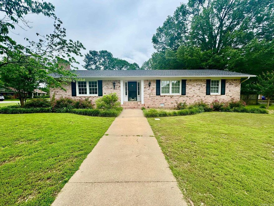 THIS PROPEERTY WOULD MAKE A GREAT AIR BNB, CLOSE TO COLLEGES AND CONWAY REGIONAL HOSPITAL -RARE FIND,WILL NOT NEED A STORAGE UNIT  WITH ALL THE STORAGE.AWESOME home located on two CORNER  lots in the heart of Conway! Walking distance to Conway Regional and UCA.  This home features 3 bedroom + 2 Bathrooms, large LIVING Area, spacious heated and cooled sunroom, beautiful ORIGINAL  BEAUTIFUL HARDwood floors throughout, tile in wet areas,repainted to soft gray hue, tons of storage,    solid wood doors, Pella windows, 2 HVAC units, 2 hot water heaters, and more! On the outside amenities   There are two large storage rooms(the one in carport is temp controlled) , a large permanent storage building, and a pull through driveway perfect for RV Parking and    a sprinkler system,  leaf guard gutters! Call today for your private showing.  The fridge will convey with acceptable offer. Roof replaced late 2024 and whirly bird vents added. AGTs see remarks