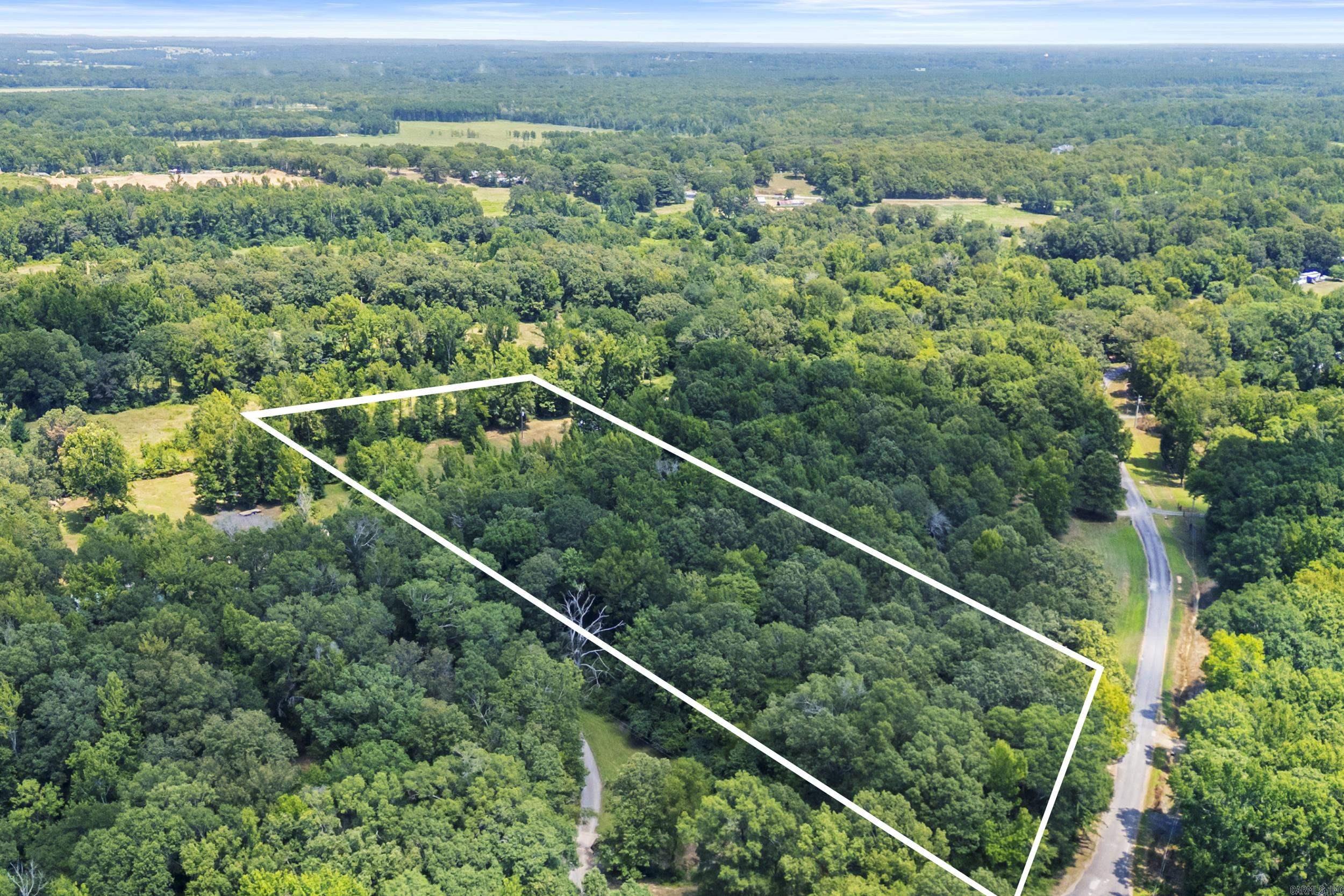 Spanning +/- 5 Acres directly adjacent to 514 Katie Lane, the lot includes septic already installed. It's a level lot with wooded terrain offering a natural setting ideal for building or a mobile home. Property sold as-is.