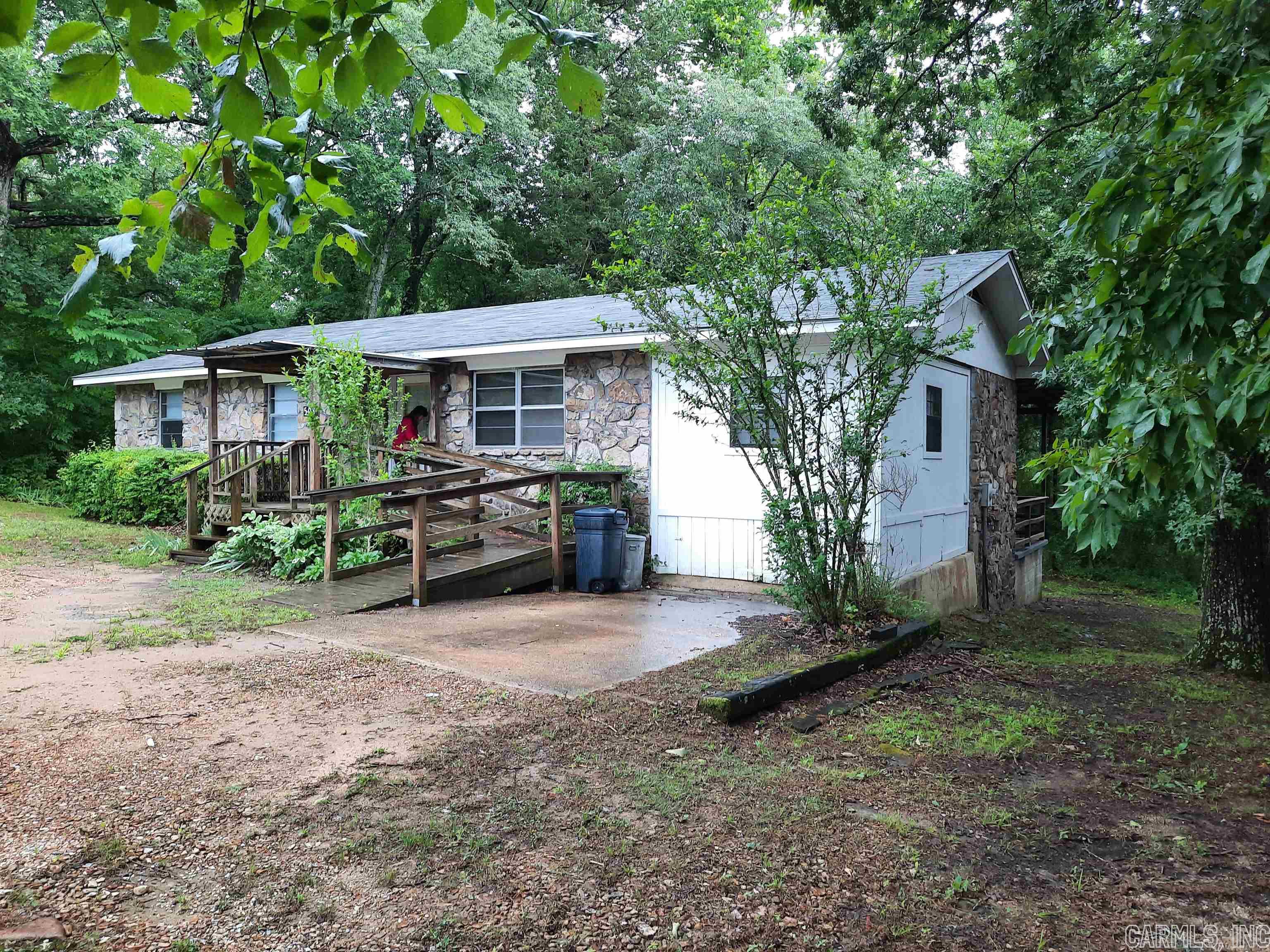 3 bedroom 1 bath plus large bonus room. Is on nice 1/2 acre lot in town. Home has several updates including new refrigerator, range, dishwasher, laminate flooring. Storage building will convey. There are several flowering shrubs, nice landscaping. There is a small wet weather creek in the back. Home has large deck on the back for all of your grilling and entertaining enjoyment.