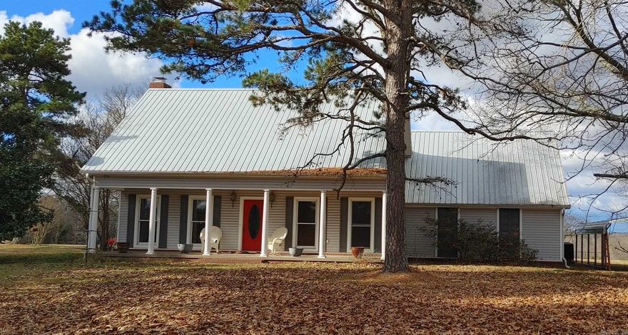 Spectacular views from this beautiful farmhouse situated on 80 acres! More than half the acreage is pastures,fenced and cross fenced, beautiful grass for hay, two ponds, the remaining is wooded for hunting deer and turkey or exploring. The extra large 50x80 barn can store equipment, hay or house animals and contains a finished area for office.  This well built home has 3 beds and 2 full baths, primary bed/bath on main level. Two beds and one bath upstairs. Large family room with brick fireplace and gas log insert. The tiled sun room is a beautiful bonus to this home. It leads out the large back deck with amazing views of the wildlife on the back half of the property. Wood blinds throughout home. The bright kitchen is nicely appointed with oak cabinet doors and tons of storage. The attached dining area also enjoys private views of the back of property. The separate laundry area is complete with built in ironing board, washer/dryer connections and storage. Oversized 2 car garage and additional carport provide plenty of parking for vehicles. This house has amazing storage throughout with multiple closets in bedrooms and floored attic storage. Schedule your showing today!