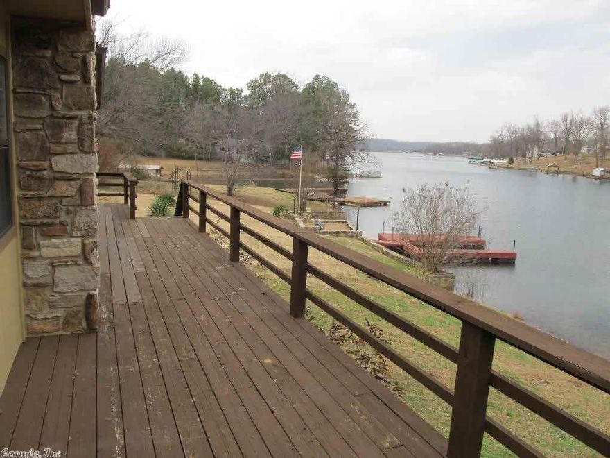 This could be your lakefront home! Ready to occupy this exceptionally clean, updated home is on Lake Thunderbird. Upstairs has 2 bedrooms and 2 baths divided by a spacious living room. There is a fireplace, large deck, double carport and a basement bedroom with additional space for a game room. Priced below market at $169,000.
