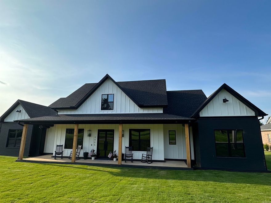 Modern Farm house custom home across from golf course, Brick and Hardie Board siding, huge screened patio, wood ceilings, gas log fireplace and outdoor kitchen plumbed, Vaulted Great room with wood beams, open kitchen plan with 9ft island, office, Iron front entry doors, Owners suite with vaulted wood ceilings and ensuite bath w/make up area and double tiled shower, large laundry w/cabinets, pantry and 1/2 bath, three car garage side entry, Brick Gas Horizontal fireplace in Greatroom, guest suite has private bath and two other bedrooms share a bath between, this home has all custom features including GE Cafe Appliances with Gold accents (special order) and ice maker