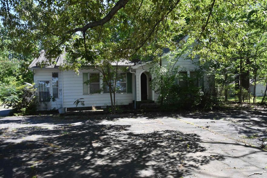 Looking for the perfect investment property... look no further.  This home has so much potential, a large paved lot.  Once used as a catering business.  Space galore and a must see.