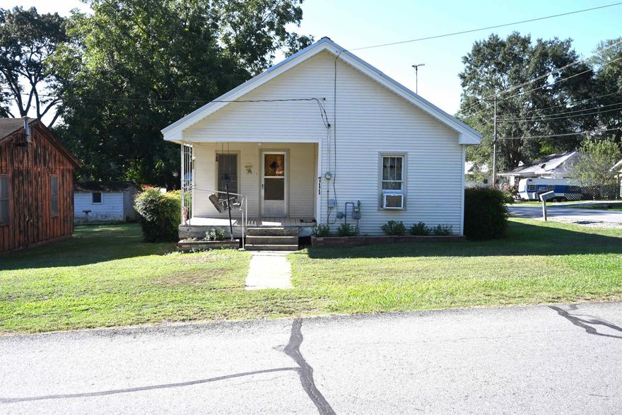 Don't miss out on the cutest house and lot in downtown Sheridan.  This 2 BR 1 BA house is absolutely one of the best kept older homes in Grant County.  New Carpet, newly painted, and brand-new water heater.   Metal roof is approx. 5 years old. Small carport outside and multiple storage buildings.  Great small garden area as well as a beautiful producing Pecan tree w/ lots of shade. *Agents see remarks
