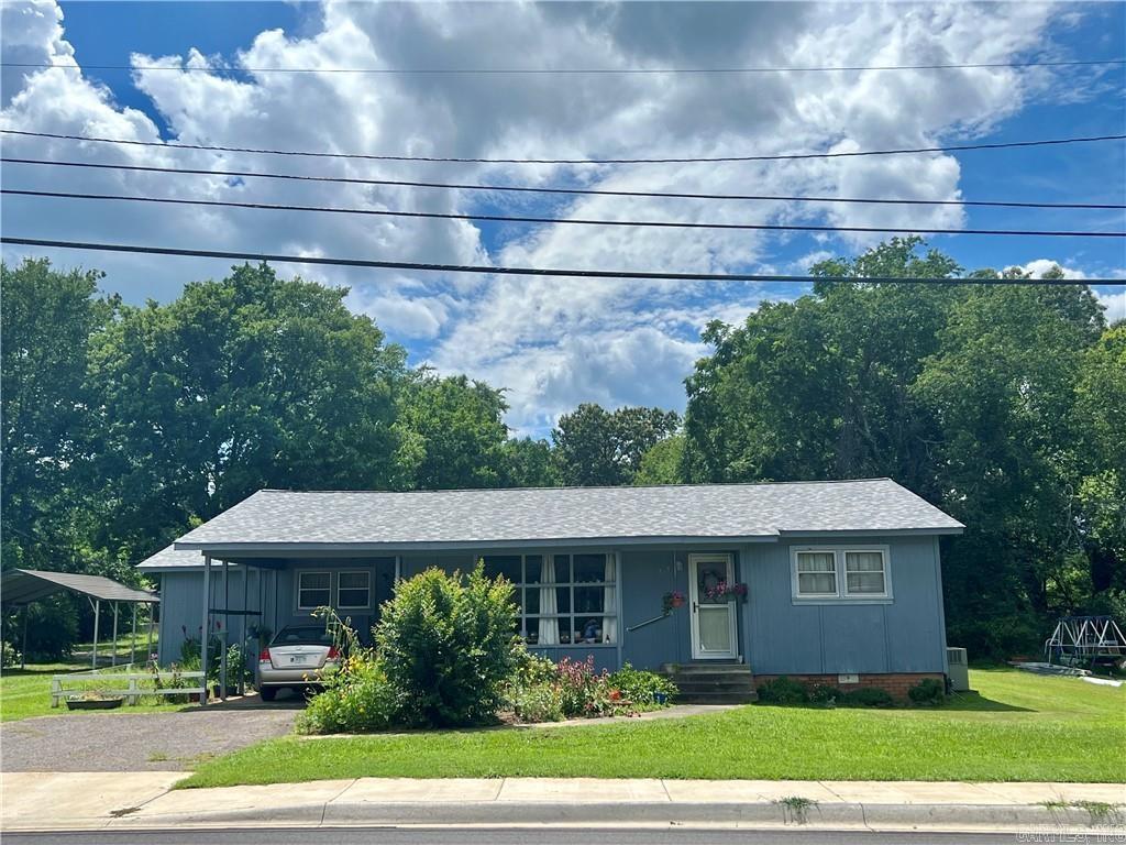 Sit and relax on your covered porches in the city limits of Clarksville on your almost 1/2 acre manicured lot. this lovely home has a new roof and an easy accessible storm shelter. large open kitchen with lots of cabinetry and dine in area with a huge window to enjoy and let in the light. This property offers a split floor plan with a large suite with its own bath. The other two rooms are of nice size and have a bathroom between them laminate looking hardwood floors throughout the home spacious living with all the conveniences Clarksville city living has to offer. this property is within walking distance to the university of the Ozarks over 1300 ft.² of living space and two covered carports Call for your showing today. This one wonāt last long.