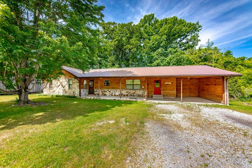 Welcome to your own private slice of country charm—where comfort, space, and character come together beautifully. This inviting 3-bedroom home sits on 1.75 picturesque acres and features stunning hardwood floors in the family room, anchored by a cozy rock fireplace with a gas stove. The kitchen is well-appointed with granite countertops, stainless steel appliances, a gas range, and a convenient breakfast bar. The spacious primary suite includes a walk-in shower, a large walk-in closet, and direct access to a covered back porch—perfect for relaxing mornings or quiet evenings. An oversized laundry room offers abundant cabinet storage and flexible space ideal for a home office or hobby area. Outside, you’ll find thoughtfully designed landscaping, blackberry bushes, and fruit trees, along with four storage buildings—including one equipped with dog pens and electricity, plus a dedicated chicken shed—making this property as functional as it is charming.