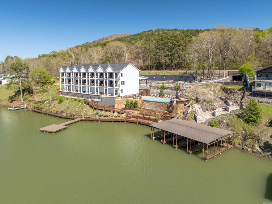 231 Ledgerock Road  /RIVER BLUFF TOWNHOUSE DEVELOPMENT… Eleven (11) Lake Hamilton waterfront and view lots...ALL SITES ARE APPROVED FOR NIGHTLY RENTALS AND DO NOT FALL UNDER THE CITY'S LIMIT...Building site Block 3 consists of (1) covered boat dock and a 40'x60' building footprint (1/2 of the foundation footing is constructed) approved for 1 or 2 units.  This site is located immediately adjacent to the infinity pool/waterfall and fire-pit... Beautiful 1/2-mile view down Lake Hamilton ...***It is possible to build only 1 unit on this site... ...Block 2 consists of a second covered boat dock and (9) lots (162x40’ building footprint) THIS IS THE ONLY STR (short term rental) APPROVED DEVELOPMENT SITE ON LAKE HAMILTON IN THE CITY LIMITS- GREAT OPPORTUNITY!  Owner / Agent...PLAT AVAILABLE