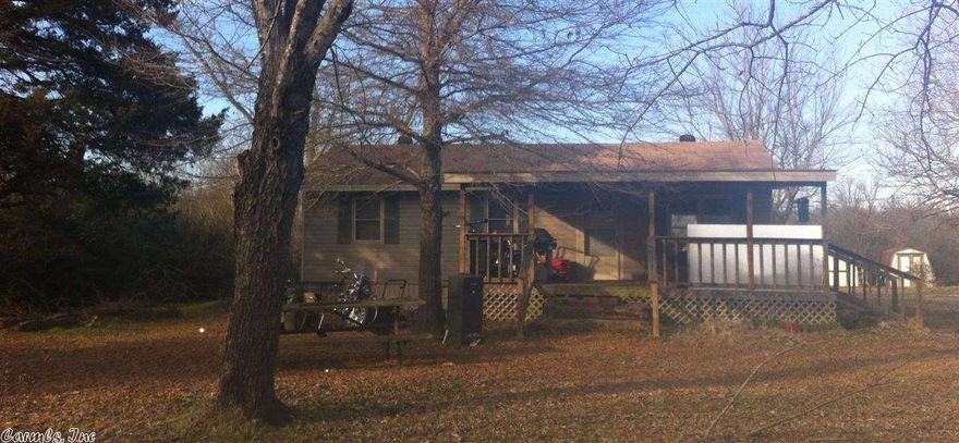 13 acres for horses, 4wheelers, pets, kids, whatever! MINERAL RIGHTS CONVEY!!  Country living w/close freeway access. 3br/1ba vinyl siding home needs a little TLC, has renter who would like to stay if possible. 2 storage bldgs. included. fridge stays. 2 septics & water meters, so you can build & let renter help you make the pymts!! There is a mobile home on property that does NOT belong to seller, & will be removed, or owner will sell separately.