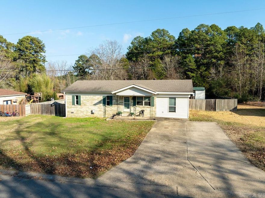 Welcome to this charming all-brick home offering 3 bedrooms plus a bonus room that can serve as a 4th bedroom, along with 1.5 baths - perfect for a starter home, vacation retreat, or income-producing rental. Located just minutes from the highly coveted Greers Ferry Lake, this property delivers comfort, convenience, and tons of usable space.  Sitting on a huge fenced-in yard, the home features great outdoor amenities, including a boat or RV cover with a dedicated pad, plus a backyard shop ideal for storage or hobbies. Inside, you’ll appreciate updates such as a new water heater, all-electric utilities, and an HVAC system installed in 2013. The roof is approximately 2 years old, giving you peace of mind for years to come.  Additional features include an underground storm shelter, making this home as safe as it is functional.  Whether you're looking for a weekend getaway near Greers Ferry Lake, an investment opportunity, or a place to plant roots, this property checks all the boxes!  Sq Ft Approximate.