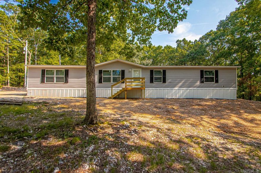 This 2018 manufactured home is situated on a permanent foundation and offers comfort, space, and privacy. Featuring a split floor plan, the home includes 4 spacious bedrooms, 2 full bathrooms, and a brand-new HVAC system for year-round comfort. Enjoy relaxing or entertaining outdoors with a newly built front porch and  back deck—ideal for taking in the peaceful surroundings. Nestled on a generous 3-acre lot, this property offers endless potential both inside and out.