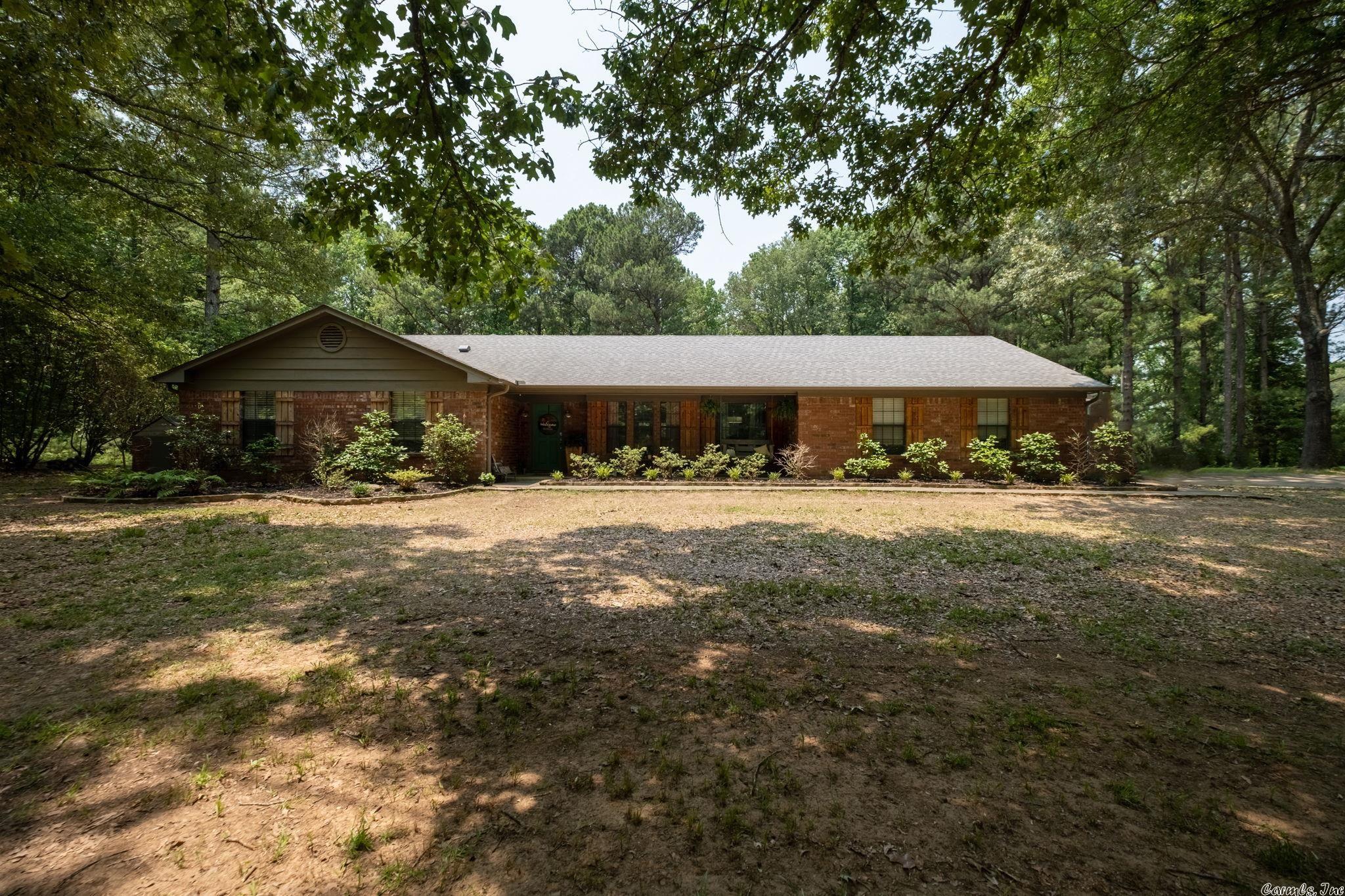 Just what everyone is wanting - acreage in Cabot School District with a nice house! Here it is! This home has 5 acres and a 30x20 workshop. Large living room with fireplace and vaulted wood ceiling, kitchen has granite countertops, glass backsplash, stainless steel appliances, breakfast bar, large pantry with barn doors. Laundry room also has barn doors! Three bedrooms on same side of house, master has ample space, master bathroom has two sinks, granite countertops, tiled shower/tub combo. Other 2 bedrooms have lots of room, guest bathroom has tiled shower. Extra room could be office, craft room or playroom. Enjoy watching the great outdoors in the screened in patio. Yard is partially fenced in for pets or children. Peaceful! Marathon water heater. Tornado shelter in garage.