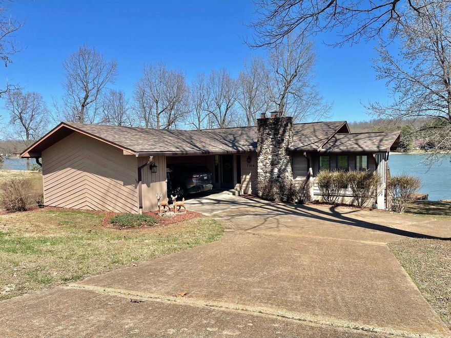 Crown this Lakefront as Yours…2 Bdrms, 3 Baths, carport, extra storage, plus a partially finished basement (not included in square footage) & sunroom. Two lots embracing privacy with a large private dock designed for expansion. From the partially wooded setting, along a beautiful fishing shoreline, to the inviting opportunities to sit by the fireplace, wood stove or campfire, the setting is a western cedar dream.