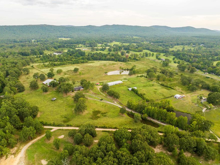 53 Acre Horse Farm in Area of Prestigeous Horse Farms, Fenced & Cross Fenced, 100'x93' Indoor Arena w/Stalls, 40'x80' 9-Horse Stall Barn w/Tack rooms, Multiple Pole Sheds, Horse Walker, Large Pond in Pasture, the Farm House needs renovation, Gently Rolling Pasture, Roughly 12-Miles to Oaklawn Race Tract.