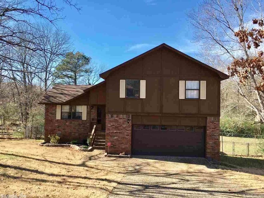 3BR,2.5BA in a Cul de Sac and Minutes to LRAFB! Looking for a nice home to sit out on the back deck and hear the water flowing through the creek? Here it is! Have great BBQs in this back yard! Fenced for kids and pets! NEW Carpet in the bedrooms, Laminate in the upstairs landing & downstairs foyer, tile in the half bath! Newer kitchen cabinets and back splash. Great Living room with a wood burning fireplace!