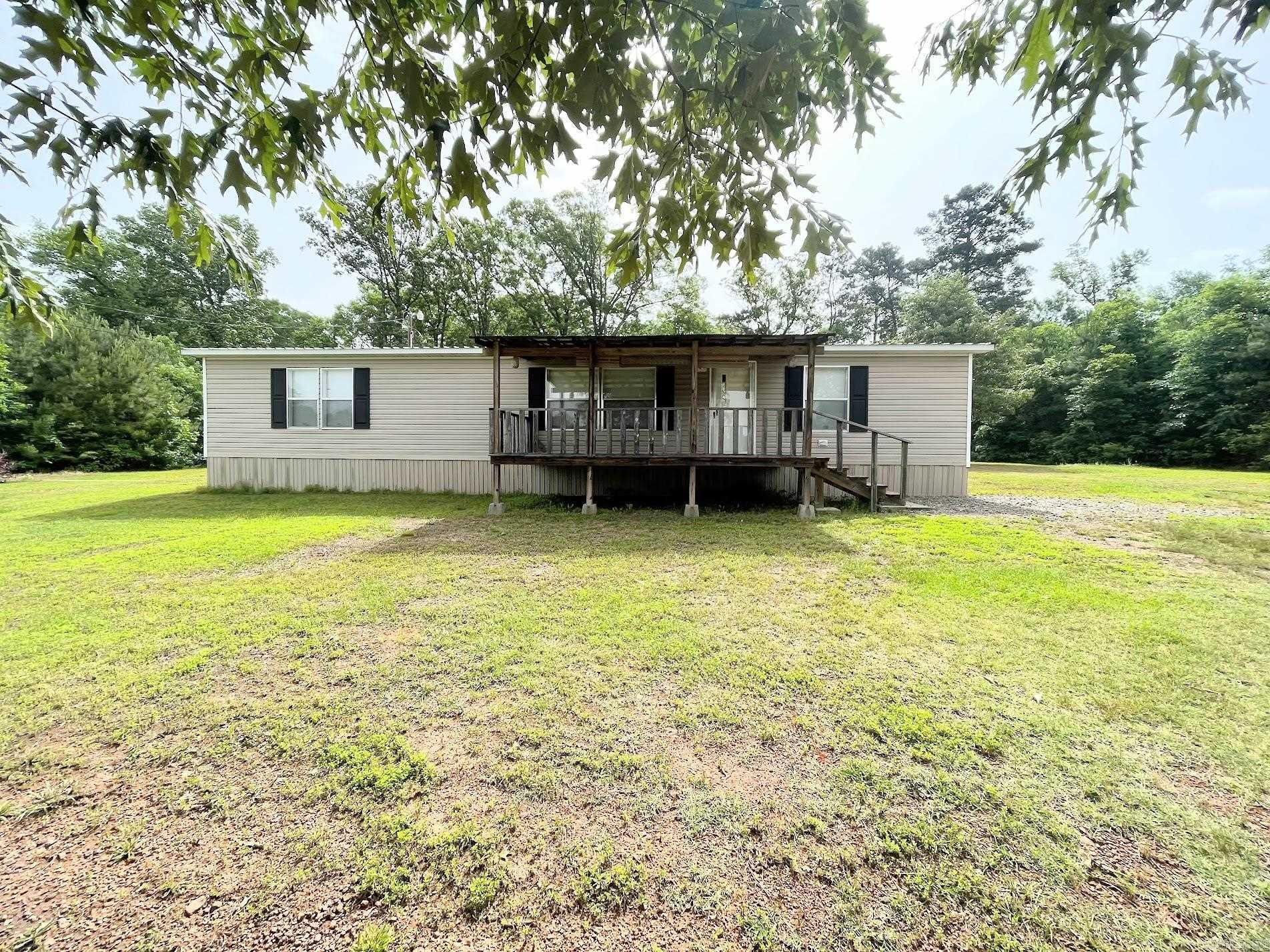 Welcome to your country paradise! This well-maintained 3-bedroom, 2-bath mobile home is perfectly nestled on 6.77 acres of open land and wooded surroundings, offering the best of privacy, space, and peaceful living. Inside, you'll find a spacious open floor plan with a cozy living room, a fully equipped kitchen, and a separate dining areaāideal for family dinners or entertaining guests. The primary suite includes a walk-in closet and private bathroom. Step outside and enjoy the natural beauty that surrounds you. This property offers endless possibilities. The acreage is a blend of cleared pasture and light woods, perfect for gardening, animals, or recreational use. If youāve been looking for an affordable country retreat with room to grow, this is it! Schedule your private showing today and see what country living is all about.