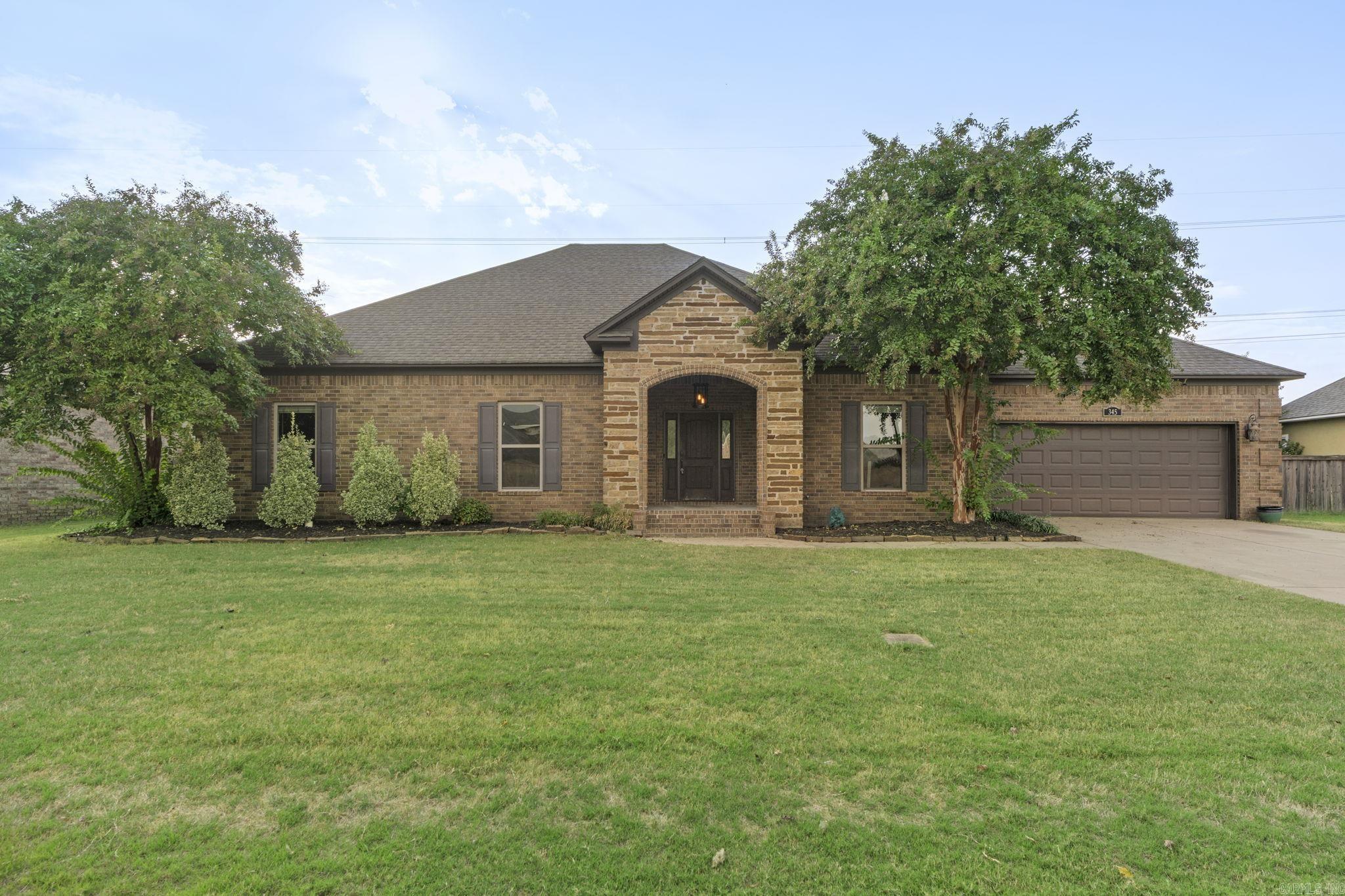 Spacious 4 bedroom, 2 bath home in a prime Conway location! Conveniently close to colleges, shopping, and dining, this property offers both comfort and convenience. Inside, you’ll find an open floor plan with a cozy fireplace in the living room, a functional laundry room, and an attached garage. The primary suite features an en suite bathroom with a walk-in closet for plenty of storage. Step outside to enjoy the large covered patio overlooking the fenced backyard—perfect for entertaining or relaxing. Don’t miss this great opportunity in the heart of Conway!