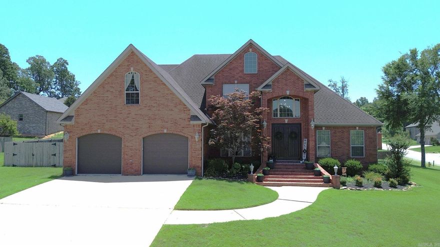 Spacious and elegant 5-bedroom, 3-bath home situated on a desirable corner lot in a quiet, walkable neighborhood close to the golf course! The main level features beautiful wood floors in the living and dining rooms, along with a gas log fireplace that adds warmth and charm to the generous living space. The kitchen offers granite countertops, a pantry, and a cozy breakfast nook. The main bedroom is a true retreat with a large walk-in closet, crown molding, and a luxurious en-suite bath featuring a whirlpool tub and separate shower. The additional main-floor bedroom offer convenient bathroom access. Upstairs, you'll find three oversized bedrooms, each with walk-in closets, and a full bath. Enjoy outdoor living on the covered patio complete with a gas log fireplace and mounted TV—perfect for entertaining year-round. This home offers space, style, and comfort in an unbeatable location!