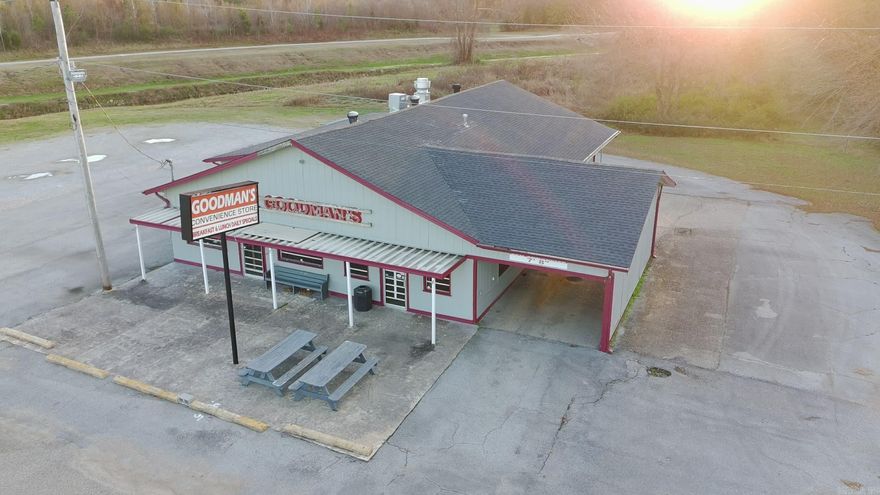 Endless possibilities with this versatile commercial property just minutes from the heart of downtown Paragould! Located at 1006 Highway 135 N, Paragould, AR 72450, this former Goodman’s store offers 3,552 sq ft of space on a .63 acre lot with excellent highway visibility, easy access, and plenty of parking. Inside, the building is already set up for success with a fully functional commercial kitchen, new walk-in drink coolers, and a fountain drink station. There’s a dedicated back office area, multiple bathrooms, and TONS of storage throughout, making it ideal for a convenience store, restaurant, specialty market, beverage store, or a variety of retail/service-based uses. A huge bonus is the drive-through, giving you even more flexibility for quick-service concepts, call-in orders, or pick-up business. The open floorplan allows for custom build-out and branding to suit your vision. Whether you’re launching a new concept or expanding an existing operation, this property is a prime, ready-to-go location with incredible potential!