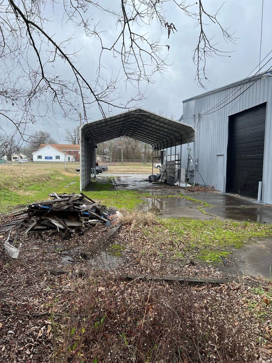 .14 acre commercial lot with large carport installed Seller will owner Finance this property