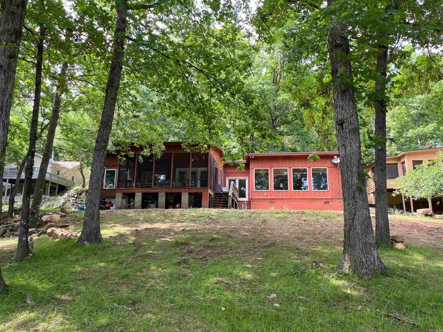 Have you ever dreamed of living your best life by the lake? That dream can become a reality with this stunning lakefront property. From almost every room in the home—and even outdoors—you’ll enjoy breathtaking views of the water. Just minutes from Hill Creek Marina and Greers Ferry. Boat right up to your back yard. Located in a more intimate part of the lake with less traffic. Start your mornings on the screened porch, sipping coffee while soaking in the serene beauty of the lake. The peaceful atmosphere here never gets old. This 3-bedroom, 2-bath home offers plenty of room to relax and entertain. There are also a few small projects that provide the perfect opportunity to add your personal touch. Extensive landscaping has been done to enhance the outdoor space. Don’t miss your chance to own this slice of lakeside paradise.  The Roof was recently upgraded to metal a few years back, New Septic system was installed April this year (2025)   Seller is offering $10,000.00 in Concession with acceptable offer