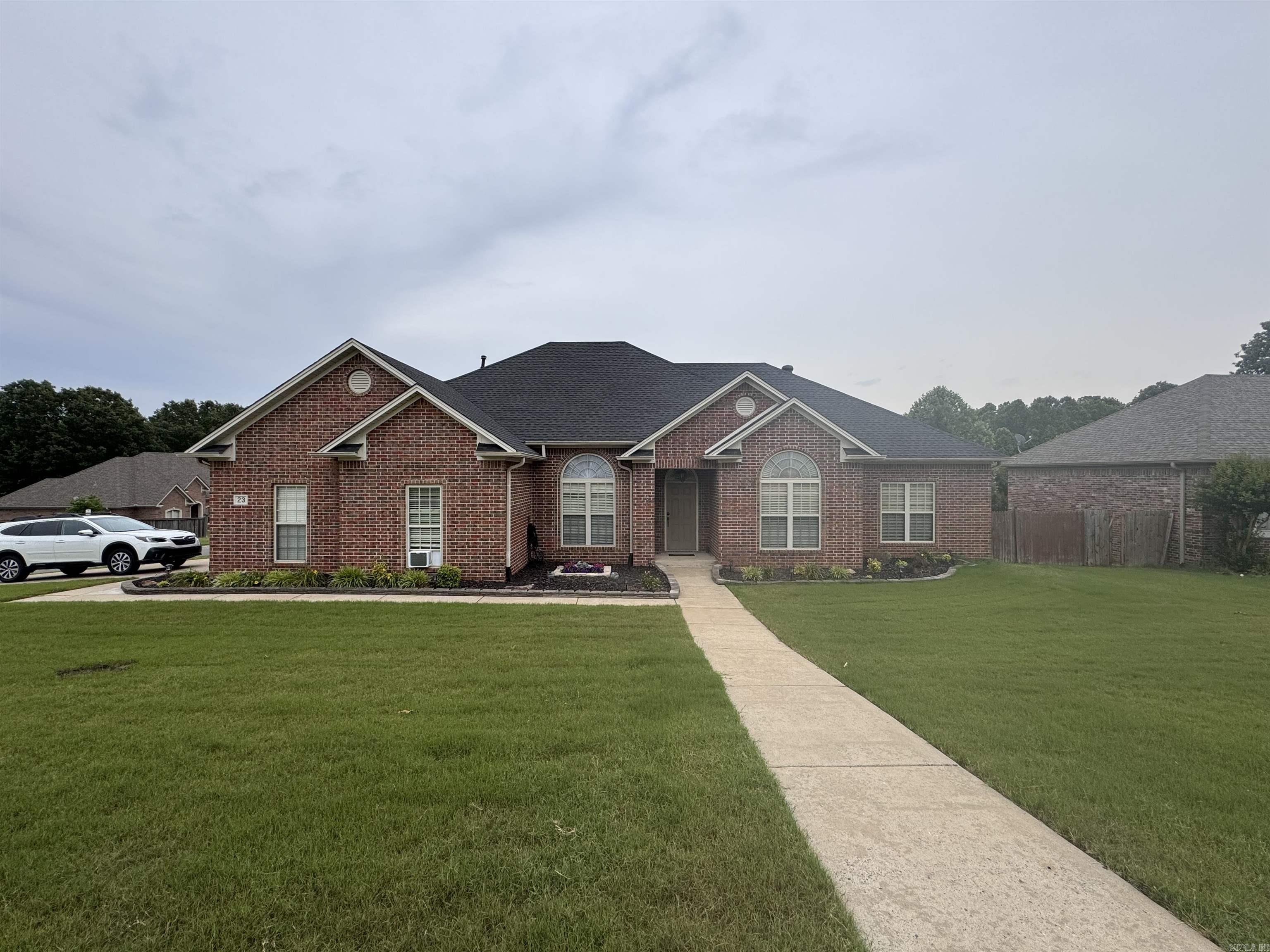 Beautifully decorated 4 bedrooms 2.5 baths corner lot near elementary, middle, junior & high schools. Enter thru front porch into foyer that opens to formal dining and great room with hardwood floor & fireplace. Great kitchen for entertaining with solid surface counter tops, tiled backsplash, SS appliances, kitchen island, tons of cabinets, pantry, and large area for friends or family. Split bedrooms. Primary suite is very spacious. Floored attic above Oversized garage, side door entry, French drain & fully fenced. Roof 3/2023, Hot water 7/2023, dishwasher 6/2022, A/C 2019. Refrigerator, Generator, washer & dryer to convey. SOLD AS IS WHERE IS. Please don't miss to read Showing Instruction and Agent Remarks.