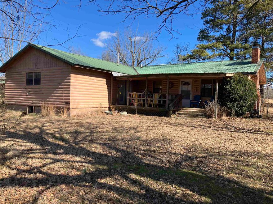 Price REDUCED!!  Very spacious 3 bedroom, 2  bath 1792 sq ft home on 3 acres m/l with pond just minutes from town. Boasts HUGE kitchen and two living rooms, one of the living rooms could be converted into a 4th bedroom. Property has a very cute new farm house style storage building, large shop and two additional storage sheds. Updated plumbing. Set back from the highway a bit, but still has visibility and could easily be a commercial location!